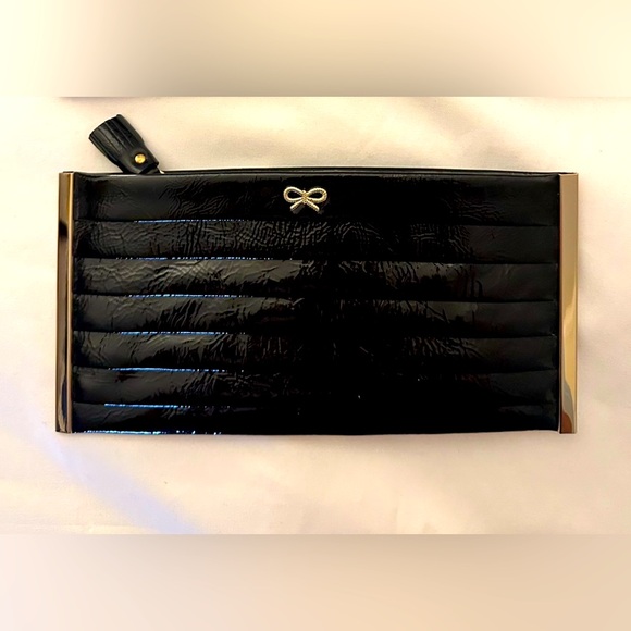 Anya Hindmarch Handbags - ANYA HINDMARCH PATENT LEATHER CLUTCH WITH ZIPPER AND GOD ACCENTS. With dustbag.